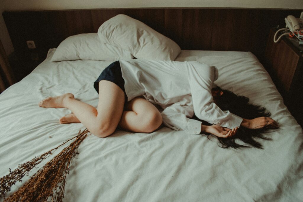 a women sobbing in bed